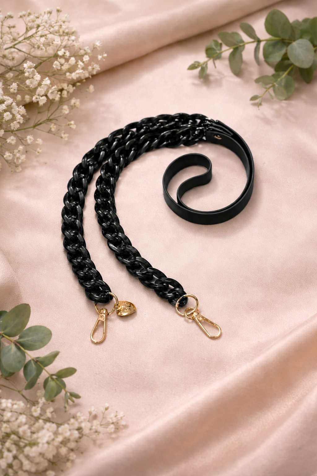 Black faux leather and acrylic crossbody phone chain with gold-tone hardware.