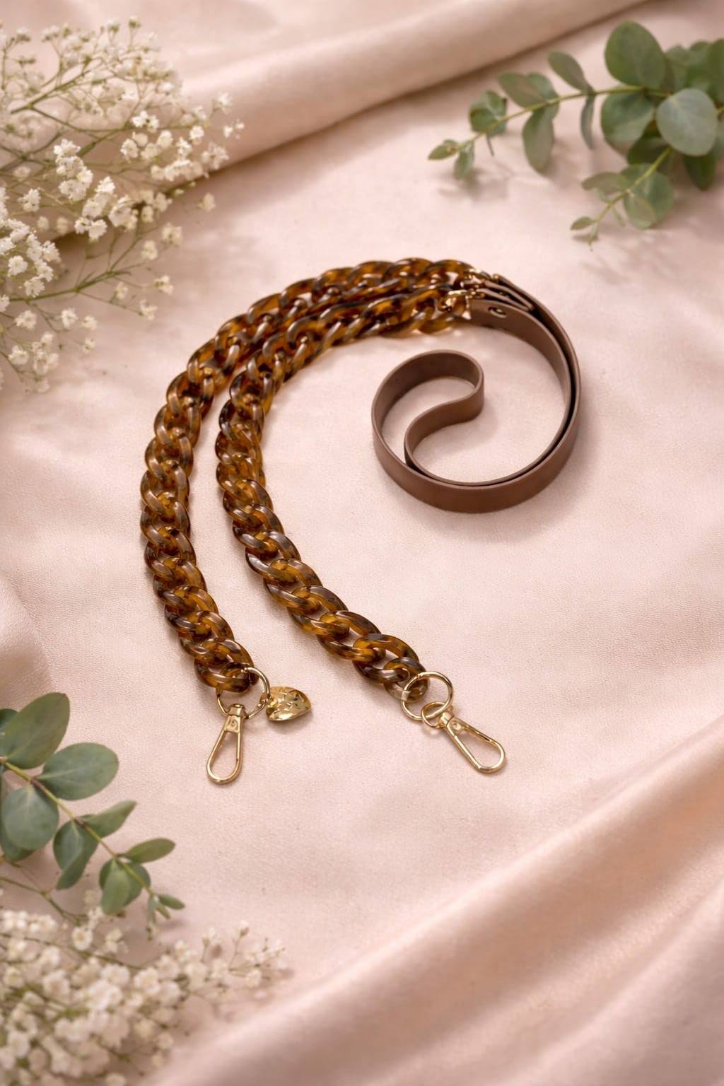 Brown faux leather and acrylic crossbody phone chain with gold-tone hardware.