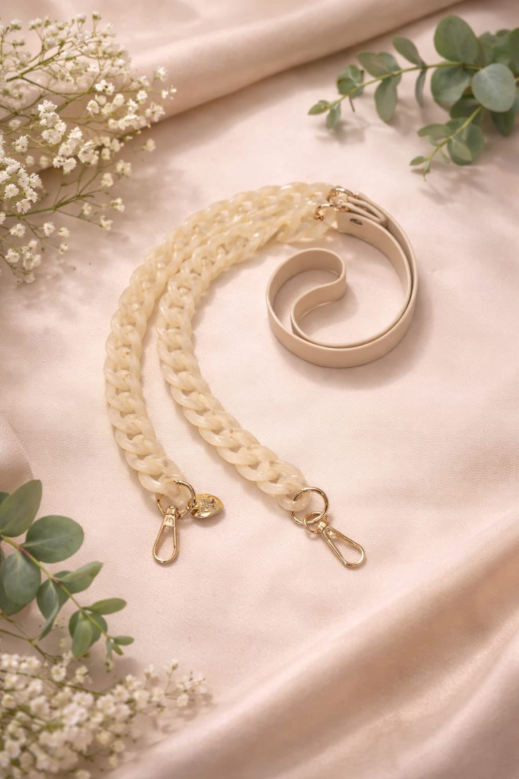 Cream faux leather and acrylic crossbody phone chain with gold-tone hardware.