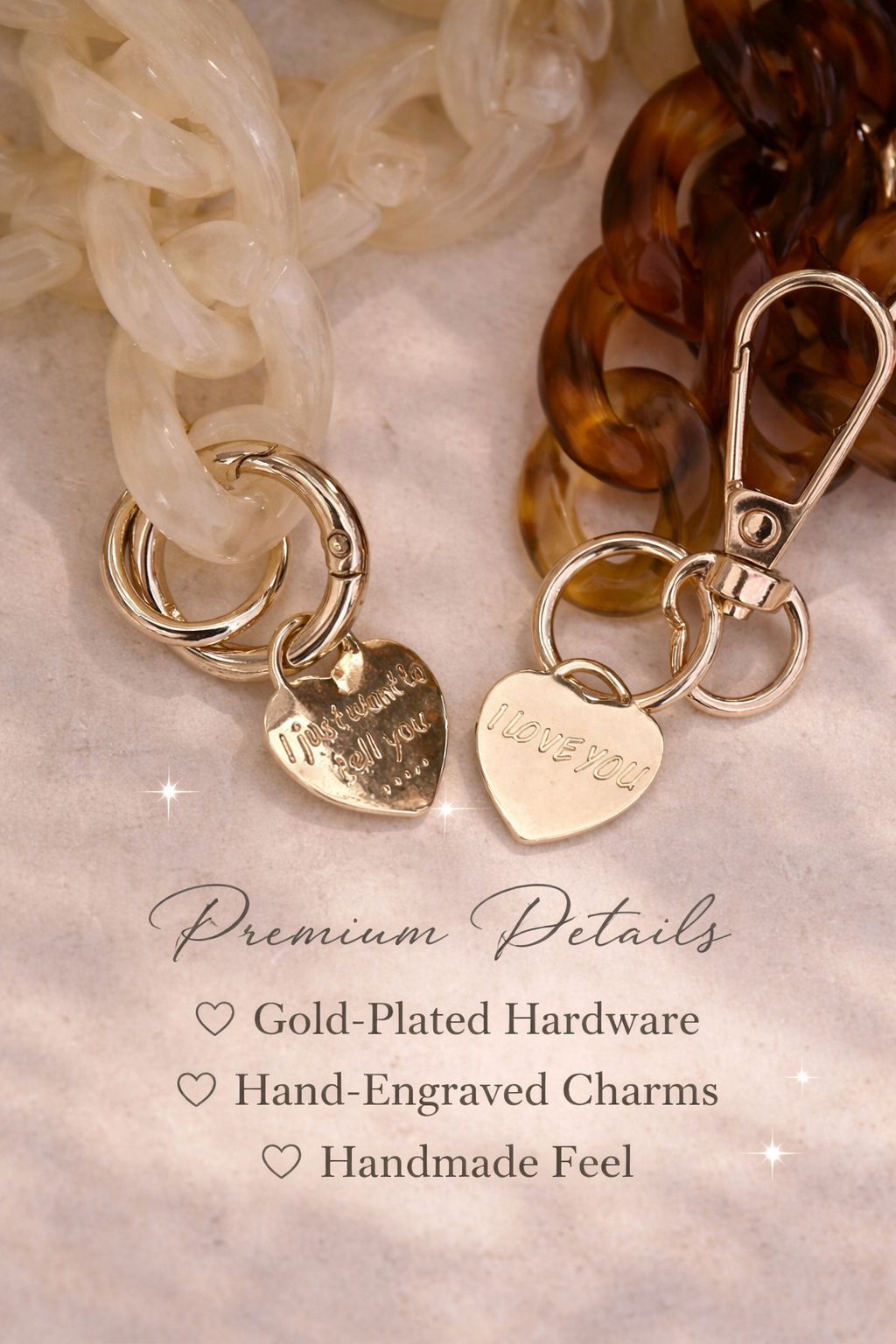Close-up of gold-tone hardware and engraved heart charms on an adjustable faux leather and acrylic crossbody phone chain, featuring the engraved messages "I just wanted to tell you..." and "I LOVE YOU".